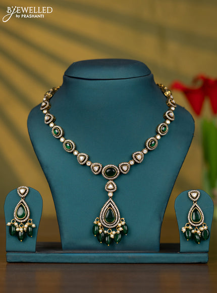 Necklace with emerald & kundan cz stones and pearl & green beads hangings in victorian finish