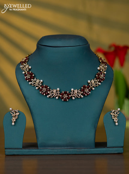 Necklace with cz stones and pearl & maroon beads in victorian finish