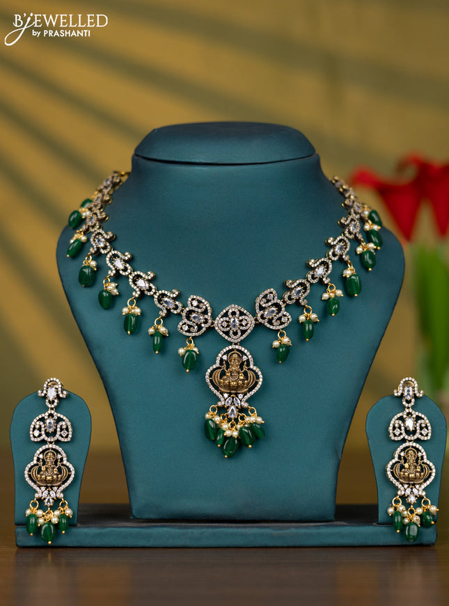 Necklace lakshmi design with cz stones and pearl & green beads hangings in victorian finish