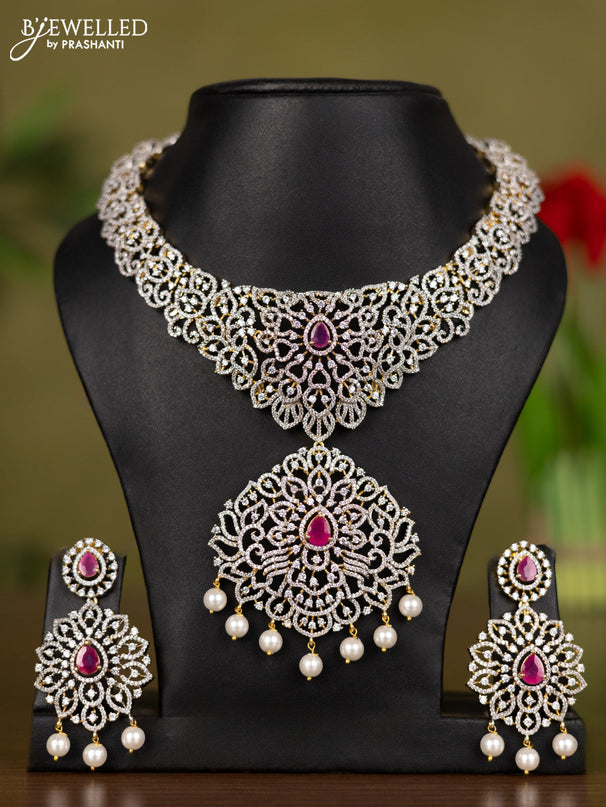 Zircon necklace with ruby & cz stones and pearl hangings in gold finish
