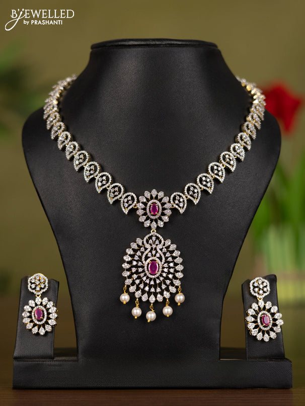 Zircon necklace manga pattern with ruby & cz stones and pearl hangings in gold finish