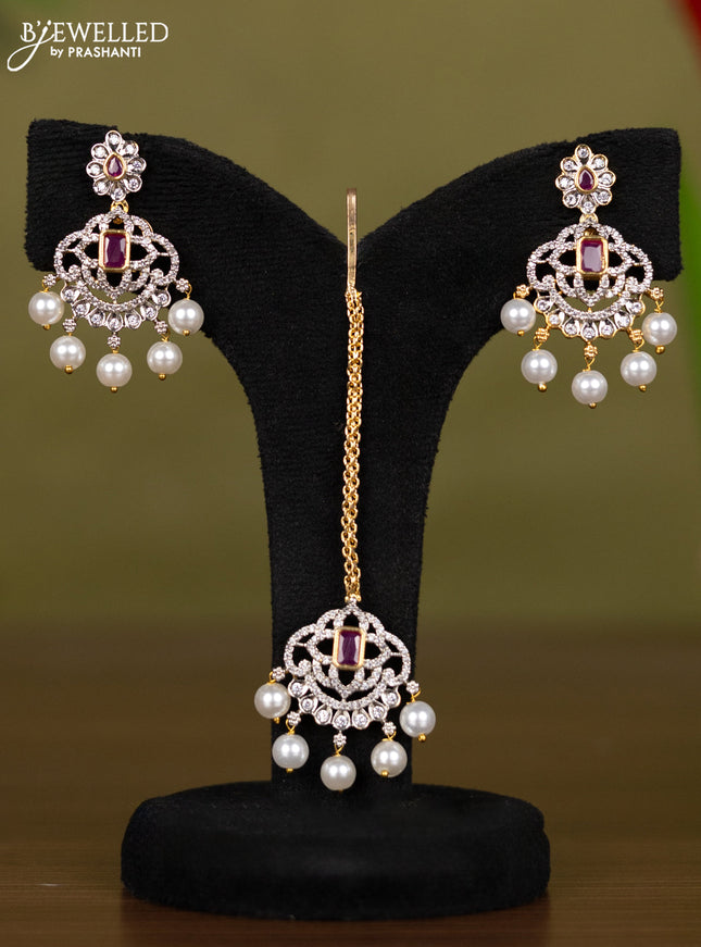 Zircon necklace with maang tikka ruby & cz stones and pearl hangings in gold finish