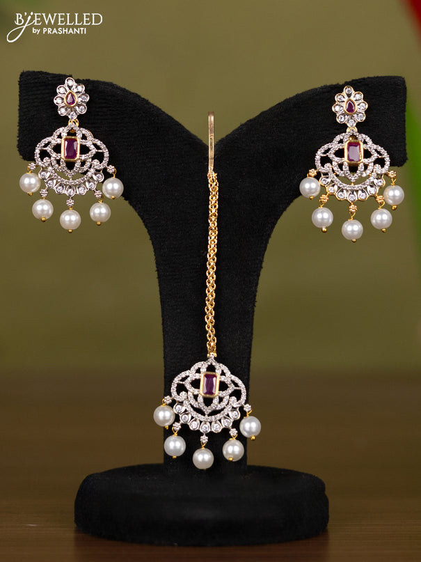 Zircon necklace with maang tikka ruby & cz stones and pearl hangings in gold finish