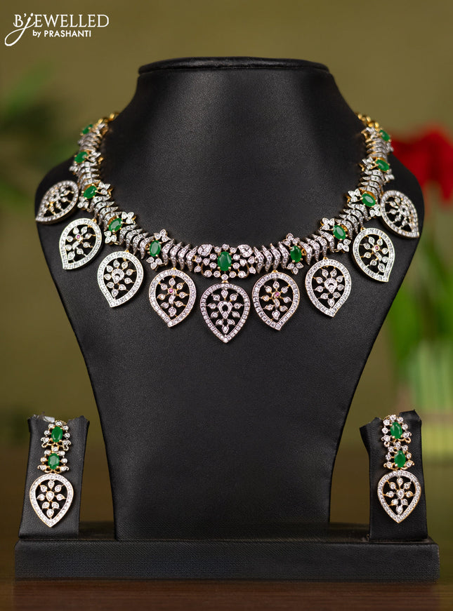 Zircon necklace manga pattern with emerald and cz stones in gold finish