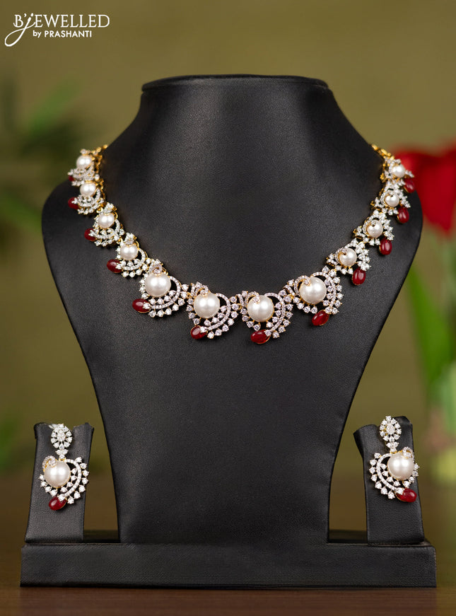 Zircon necklace with cz stones and pearl & pink beads in gold finish