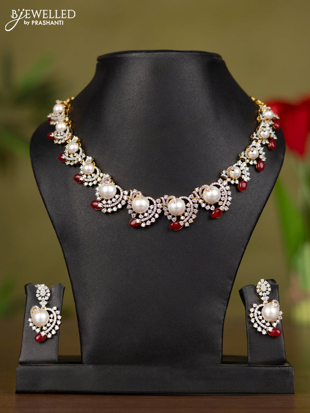 Zircon necklace with cz stones and pearl & pink beads in gold finish