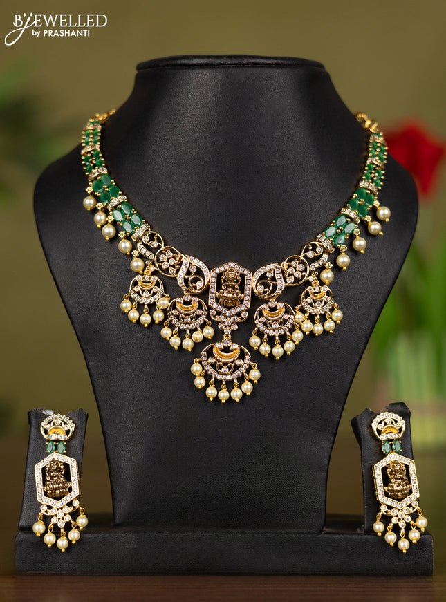 Zircon necklace lakshmi design with emerald & cz stones and pearl hangings in gold finish