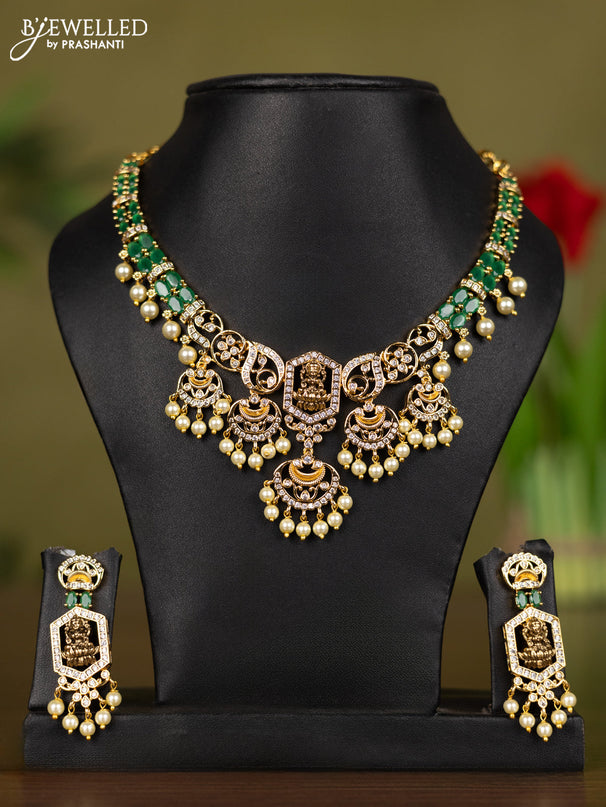 Zircon necklace lakshmi design with emerald & cz stones and pearl hangings in gold finish