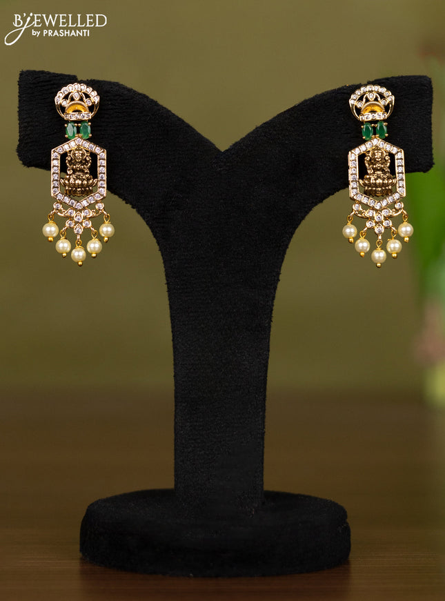 Zircon necklace lakshmi design with emerald & cz stones and pearl hangings in gold finish