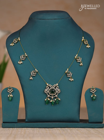 Inivisible chain double peacock design in dark green stones and green beads