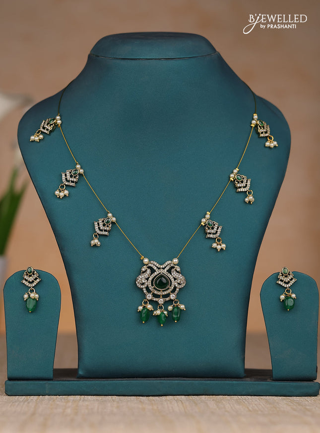 Inivisible chain double peacock design in dark green stones and green beads