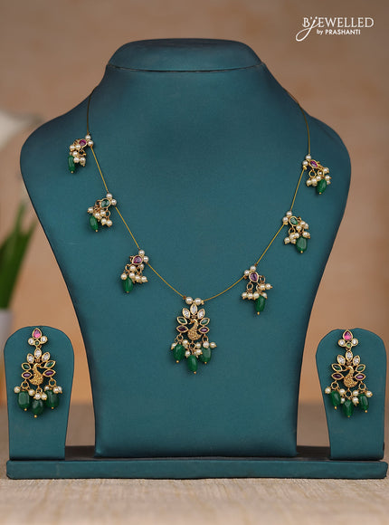 Inivisible chain peacock design in kemp stones and green & pearl hangings