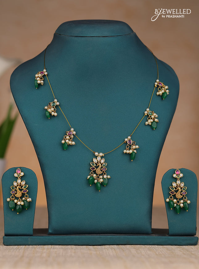 Inivisible chain peacock design in kemp stones and green & pearl hangings