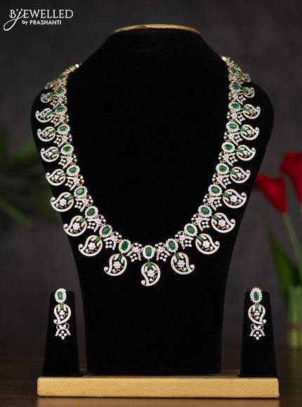 Zircon haaram with manga design in white and green stones