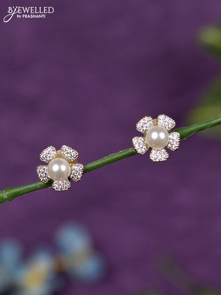 Zircon earrings floral design with cz stones and pearl in gold finish