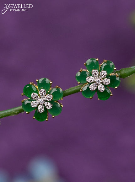 Zircon earrings floral design with emerald and cz stones in gold finish