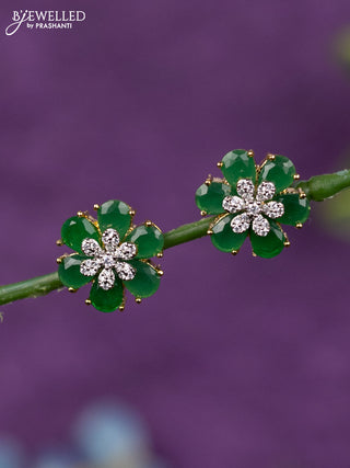 Zircon earrings floral design with emerald and cz stones in gold finish