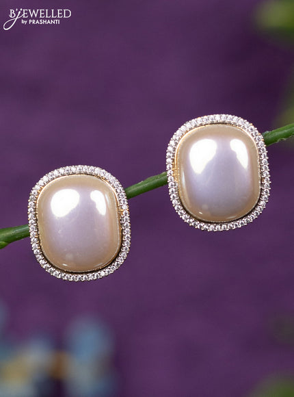 Zircon earrings with cz stones in gold finish