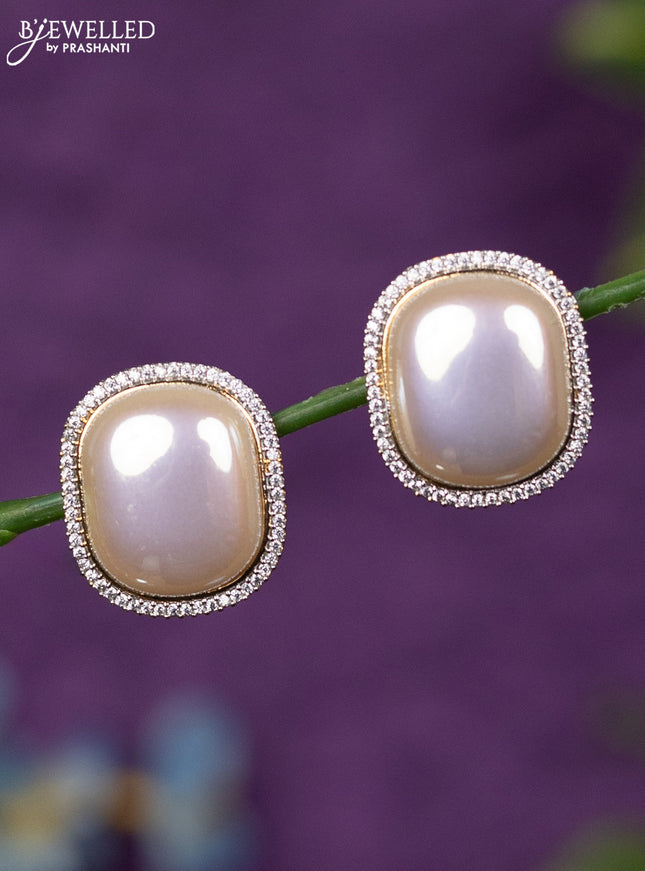 Zircon earrings with cz stones in gold finish