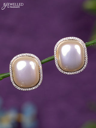 Zircon earrings with cz stones in gold finish