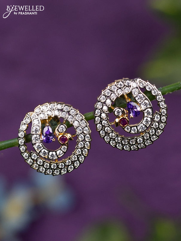 Zircon earrings peacock design with purple and cz stones in gold finish