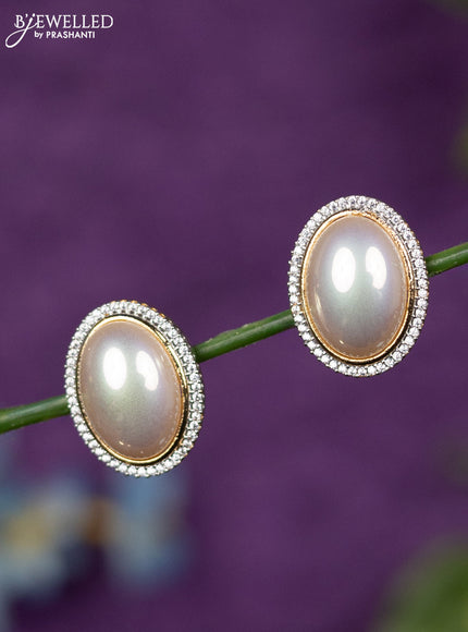 Zircon earrings with cz stones in gold finish