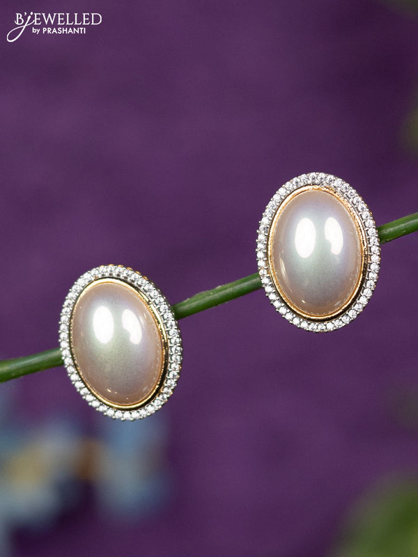 Zircon earrings with cz stones in gold finish