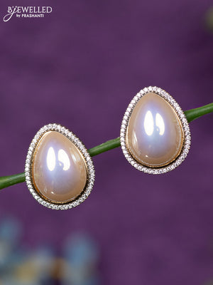 Zircon earrings with cz stones in gold finish