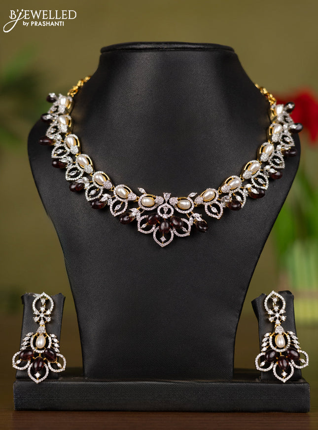 Zircon necklace with cz stones and pearl & brown beads in gold finish