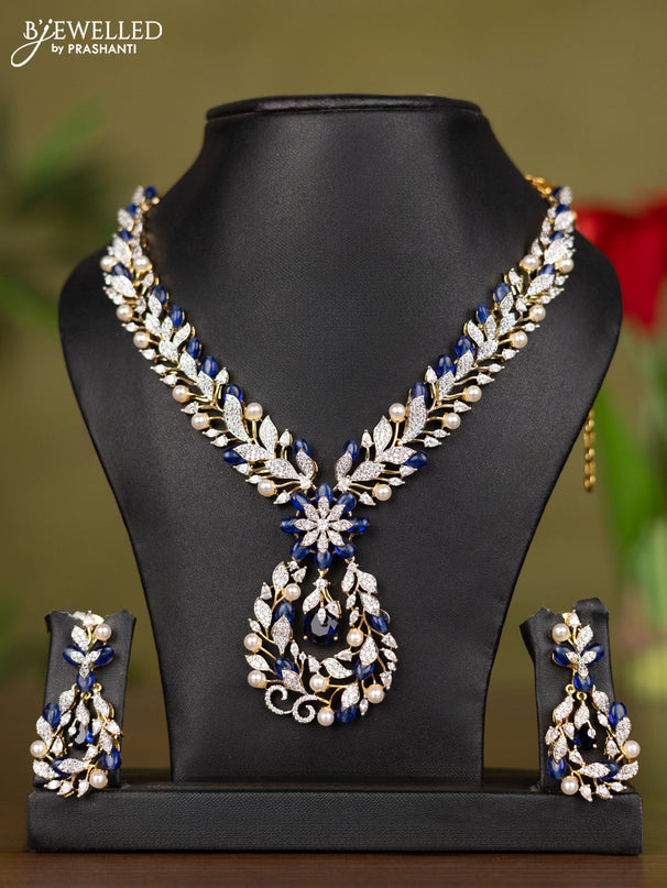 Zircon necklace with cz stones and pearl & blue beads in gold finish