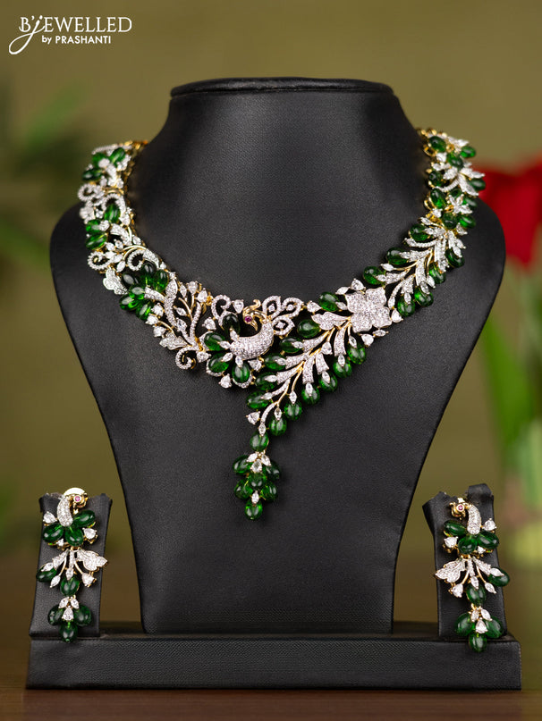 Zircon necklace with cz stones and green beads in gold finish
