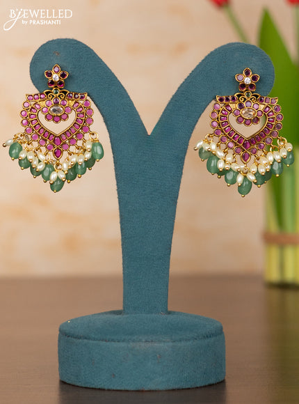Antique guttapusalu haaram with floral pendant and peacock design in kemp stones and rice pearl hanging