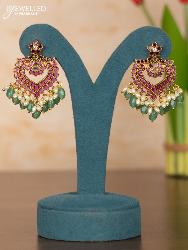 Antique guttapusalu haaram with floral pendant and peacock design in kemp stones and rice pearl hanging