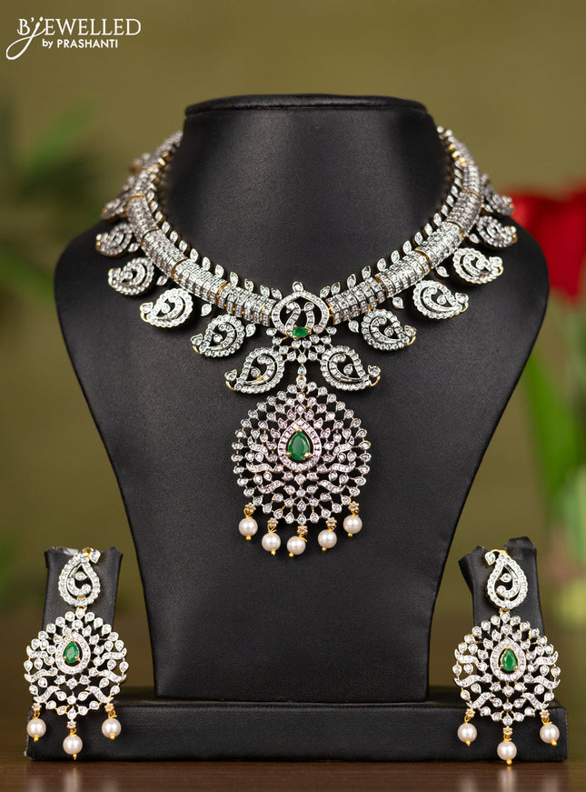 Zircon necklace with emerald & cz stones and pearl hangings in gold finish