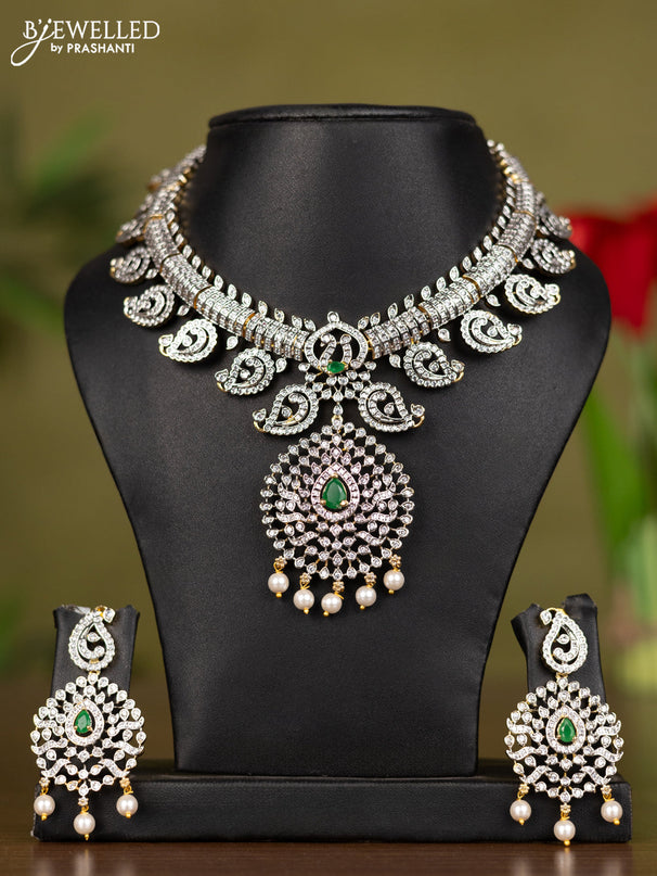 Zircon necklace with emerald & cz stones and pearl hangings in gold finish