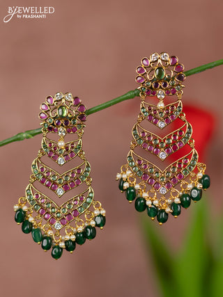Antique earrings with floral deisgn and three step model in kemp stones and green beads hanging