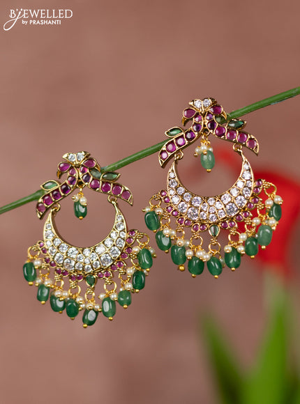 Antique earrings with double peacock deisgn in kemp and white stones  & green beads hanging