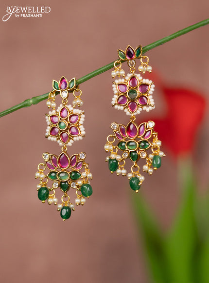 Antique earrings with lotus deisgn in kemp stones and green beads hanging