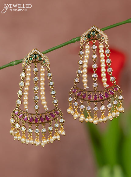 Antique earring hanging type pearl design with kemp and white stones and peark hangings