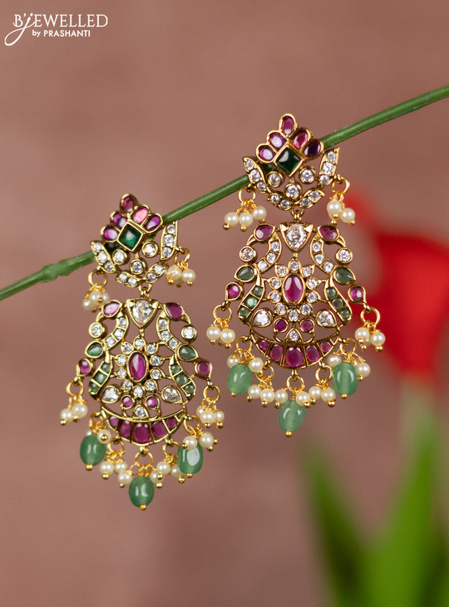 Antique earrings with double peacock deisgn in kemp and white stones  & pearl hanging