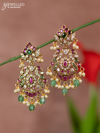 Antique earrings with double peacock deisgn in kemp and white stones  & pearl hanging