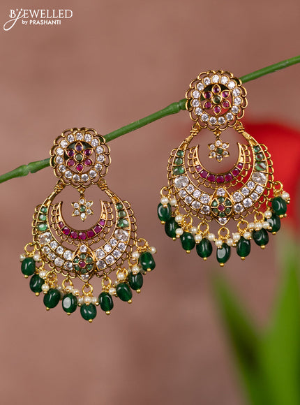 Antique earring floral chandbali type with kemp and white stones and green beads hanging