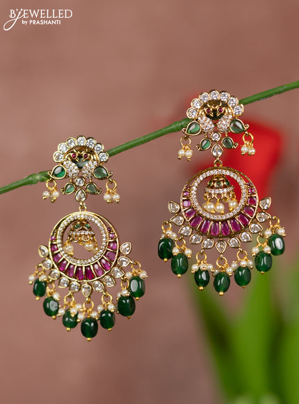 Antique earrings with chandbali double peacock deisgn in kemp and white stones  & pearl hanging