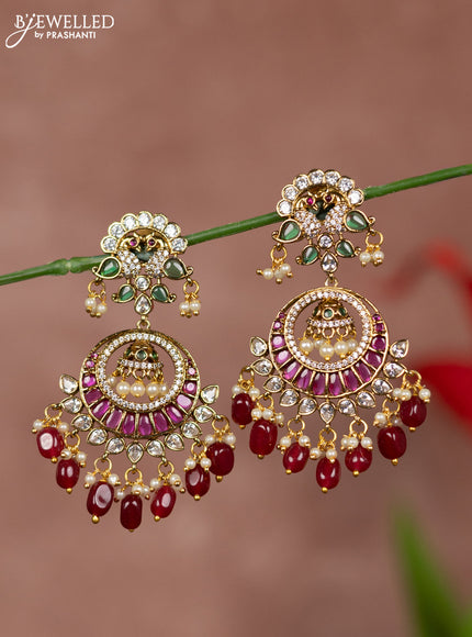 Antique earrings with chandbali double peacock deisgn in kemp and white stones & maroon beads