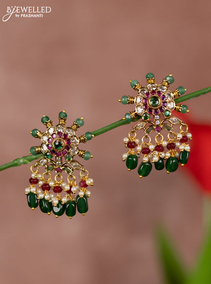Antique earrings with floral deisgn in kemp stones and green beads hanging