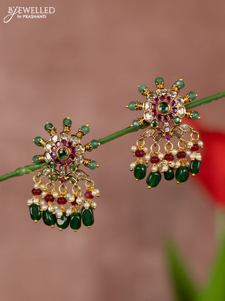 Antique earrings with floral deisgn in kemp stones and green beads hanging