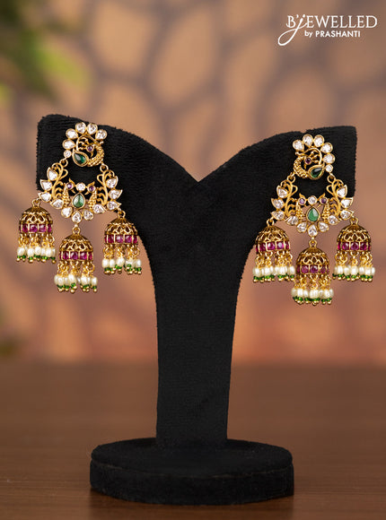 Antique jhumka peacock design with kemp & cz stones and pearl hangings