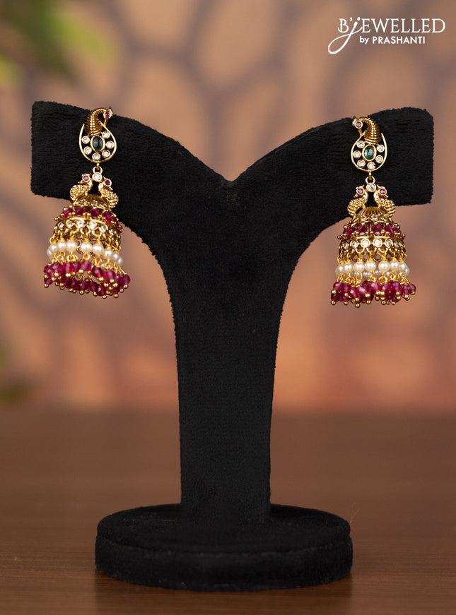 Antique jhumka peacock design with kemp & cz stones and pink beads hangings