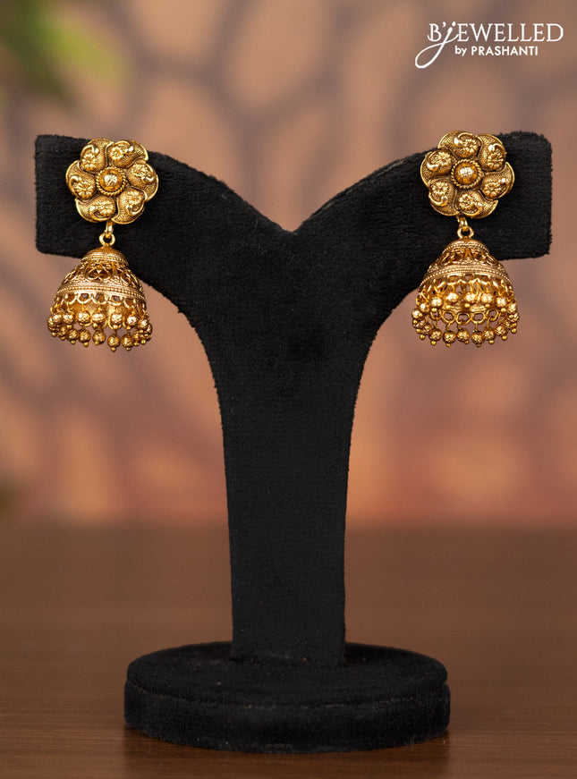 Antique jhumka with simple design and golden beads hangings