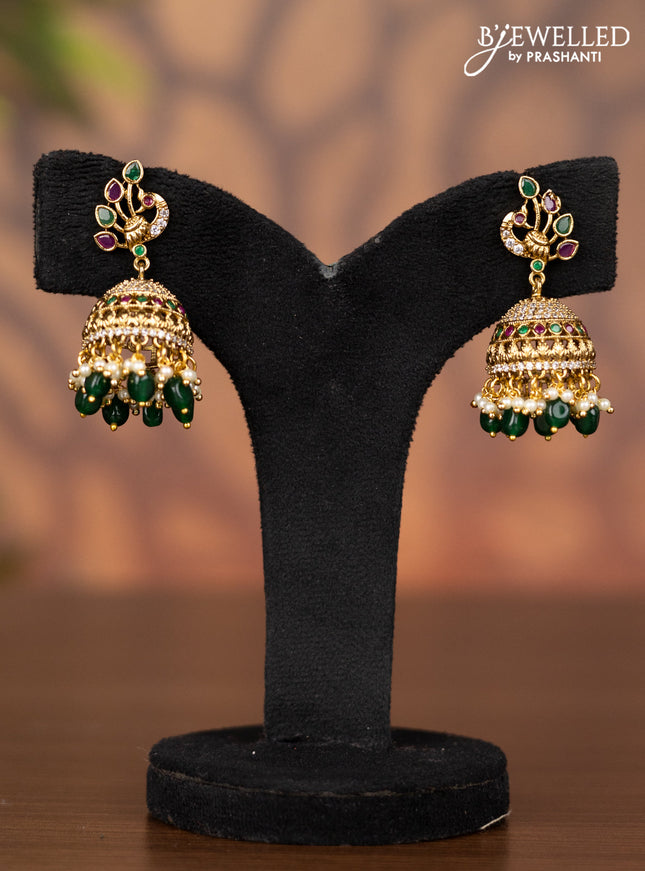 Antique jhumka peacock design with kemp & cz stones and pearl & green beads hangings